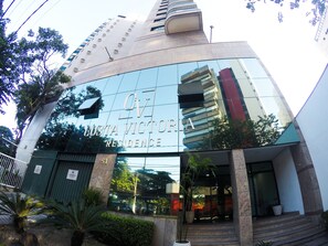 A modern building with a reflective glass facade, the name "COSTA VICTORIA RESIDENCE" prominently displayed. -  Costa Victoria Residence (Vitoria)