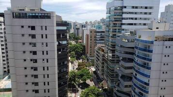 A high-rise building with multiple floors, large windows, and a modern architectural design.