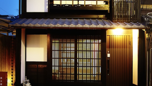 A traditional Japanese house with a wooden gate, a tiled roof, and a small porch area. - Kyoto Tradition With Modern Luxury, Family Friendly in Excellent Location (Kyoto)