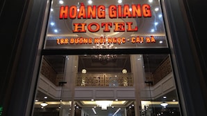 The exterior of Hoàng Giang Hotel with a prominent illuminated sign. - Hoang Giang Hotel (Hai Phong)