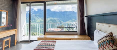 Quadruple Room, Mountain View | Minibar, desk, blackout curtains, soundproofing