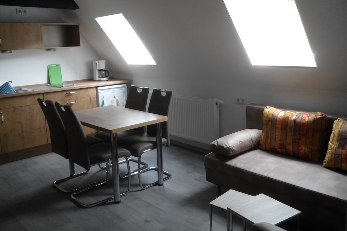 Family Suite, Balcony | Living area | Flat-screen TV
