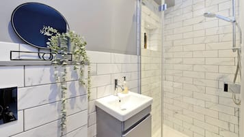 Bathtub, hair dryer, towels, soap