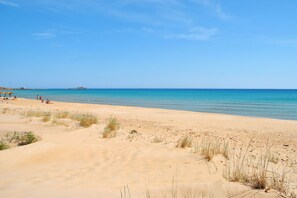 On the beach, sun-loungers