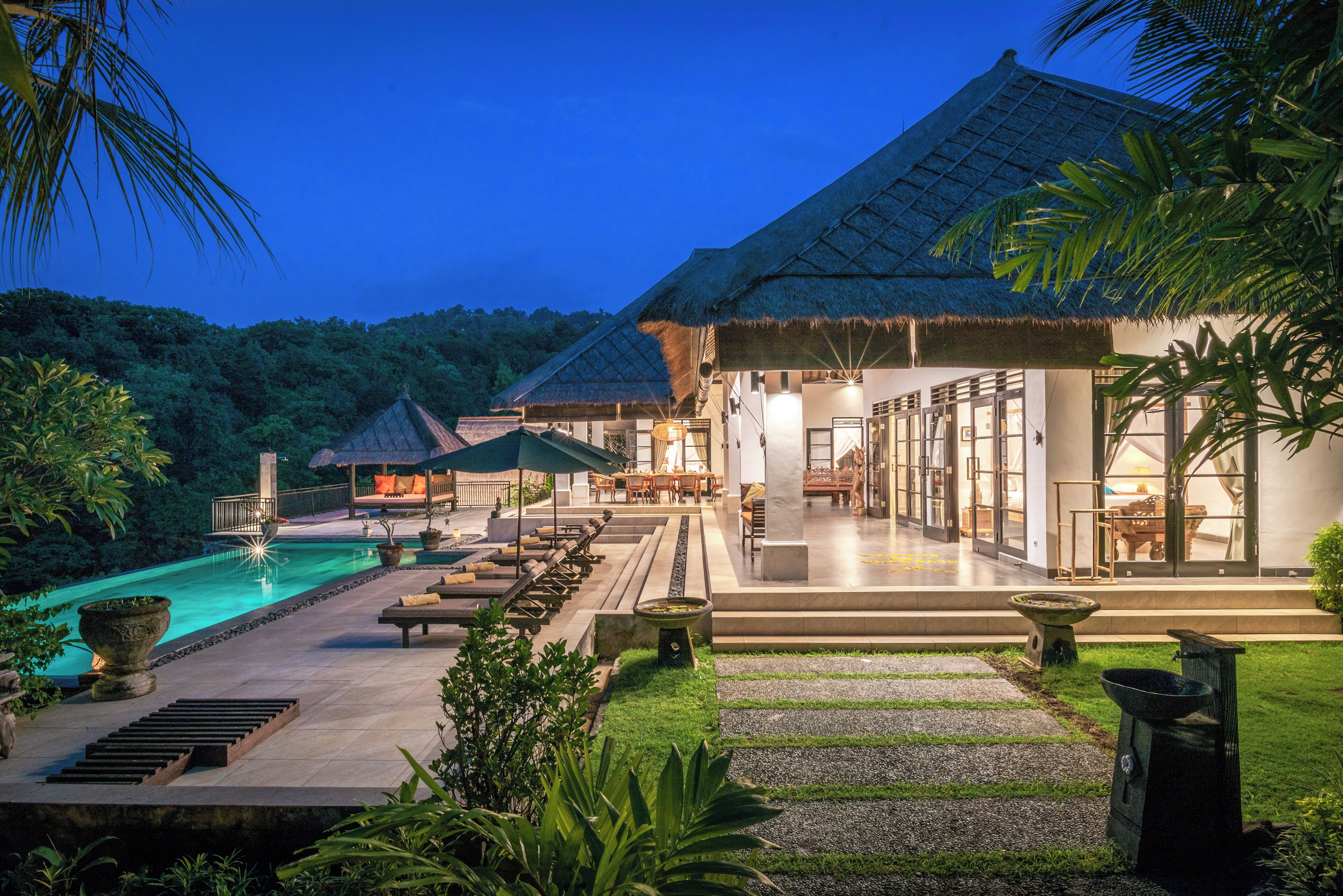 An infinity pool, pool loungers