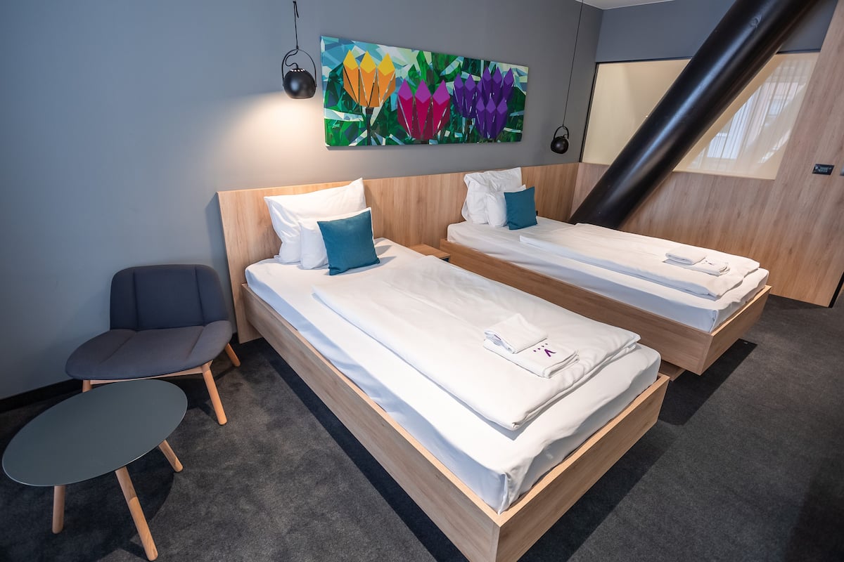 Twin Room | Minibar, in-room safe, desk, soundproofing