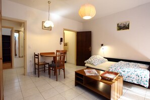Apartment, 1 Bedroom | Living area | Flat-screen TV