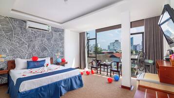 Deluxe Room, 1 Queen Bed, City View | 1 bedroom, desk, blackout drapes, free WiFi