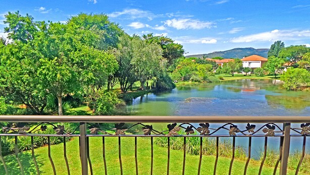 A river with lush greenery and a clear sky. - Jeanette's Villa at Westlake (Hartbeespoort)