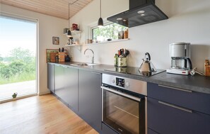 Fridge, stovetop, dishwasher, coffee/tea maker