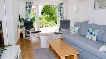 Premium Apartment, 1 Bedroom | Living room | Flat-screen TV