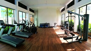 A spacious gym with treadmills, elliptical machines, and weight equipment. - Cartoonstay Minion 01 Midhills Genting (Genting Highlands)
