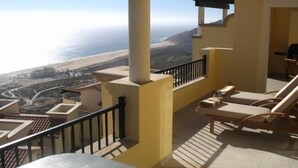 A balcony with a view of the ocean and a mountainous landscape. -  Montecristo Luxury Villa#11-Christmas/New Years-Highest Pt/Best View-12/16-1/17 (Quivira)