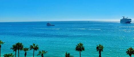 On the beach, sun loungers, beach towels