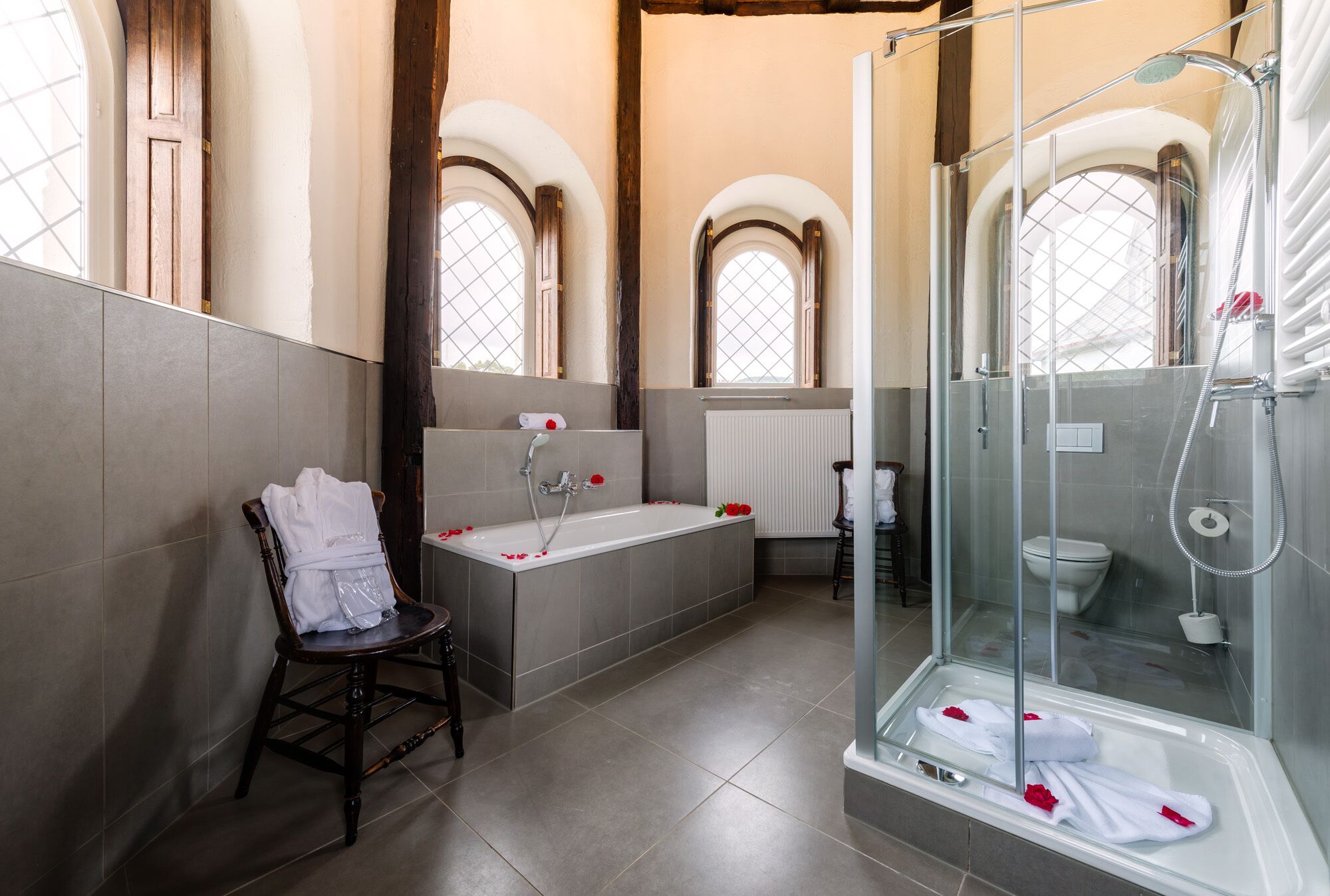 honeymoon suite | bathroom | bathtub, free toiletries, hair dryer, bathrobes