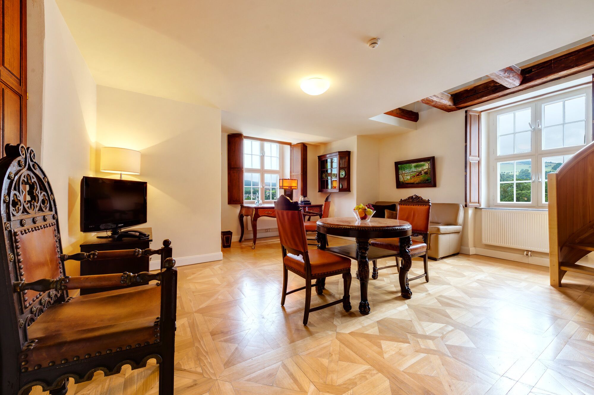 superior duplex | living area | flat-screen tv