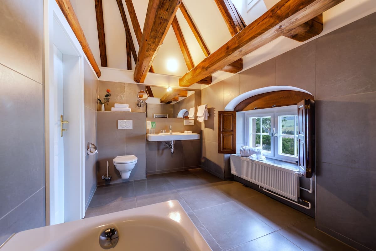 superior duplex | bathroom | bathtub, free toiletries, hair dryer, bathrobes