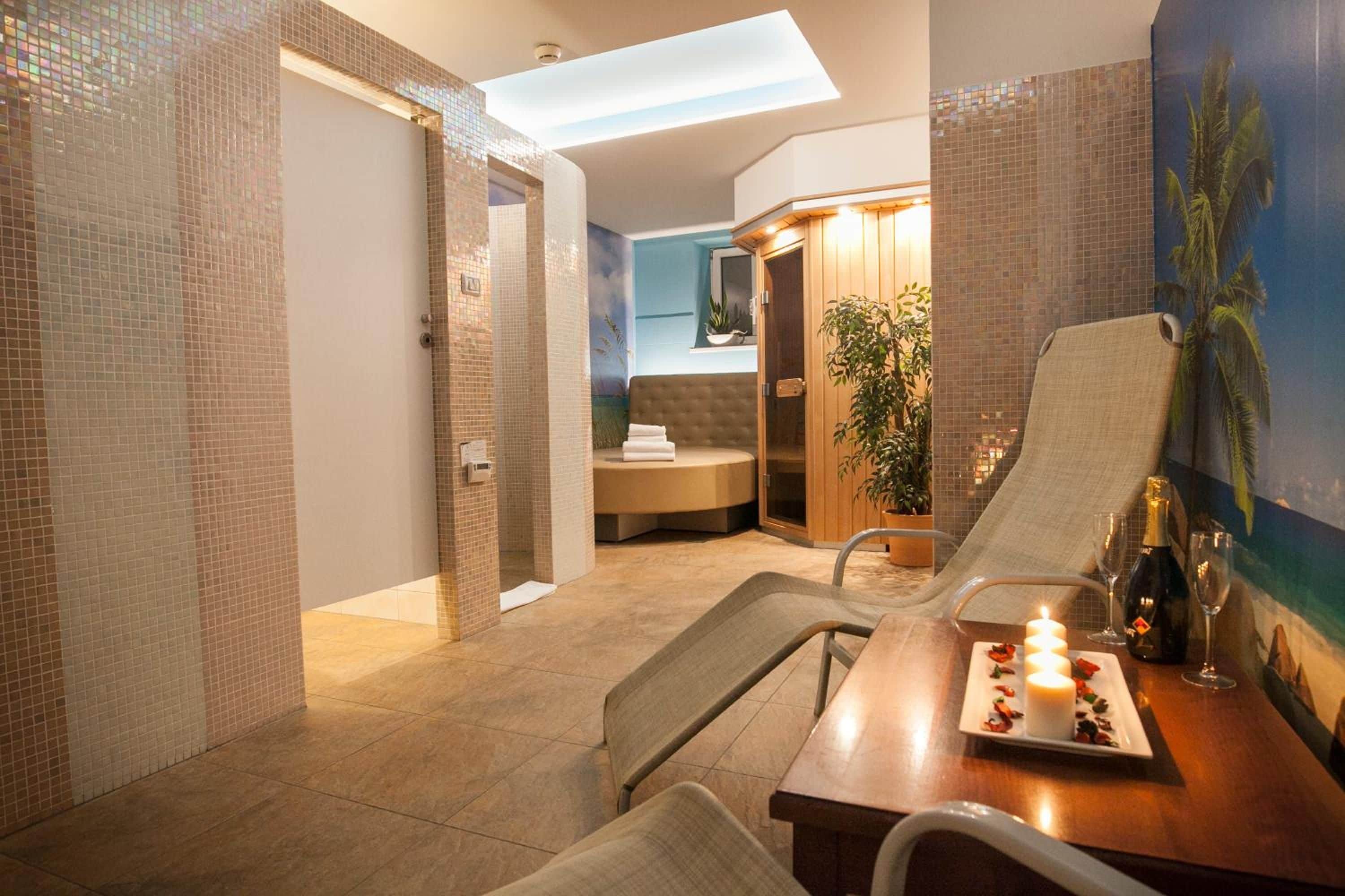A modern hotel room with a dining area, a shower, and a view of the outside.