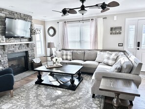 Smart TV, fireplace, books, music library