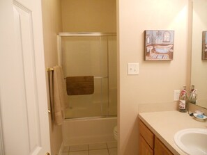 Combined shower/bathtub, hair dryer, towels, soap