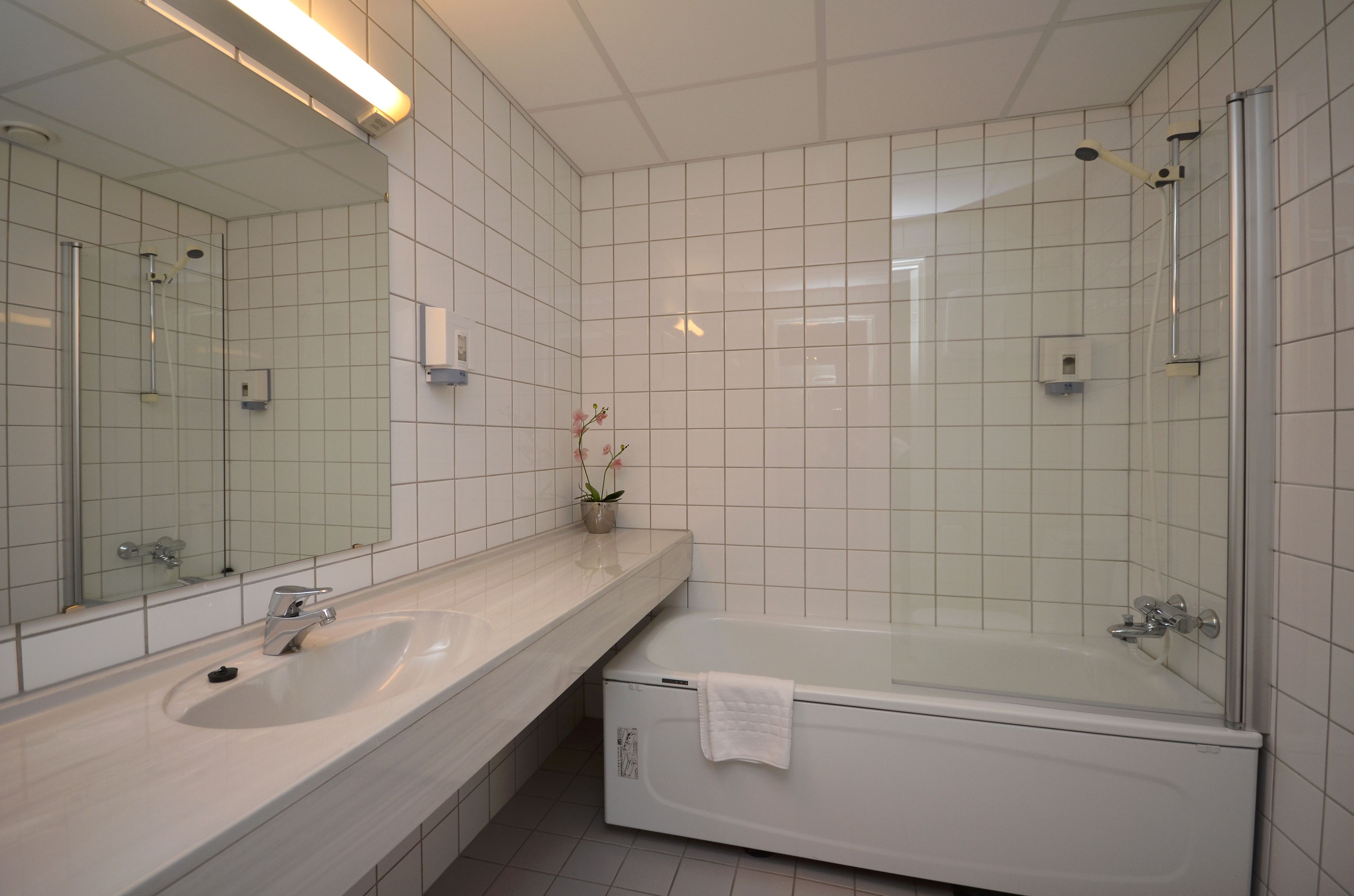 junior suite | bathroom | hair dryer, heated floors, towels, soap