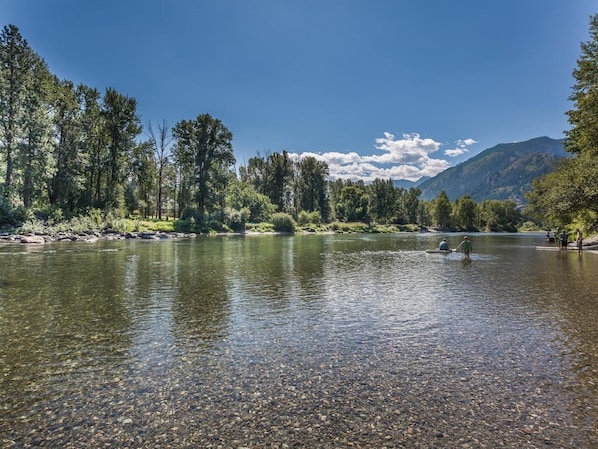 Guests can enjoy serene riverside views and engage in water activities.