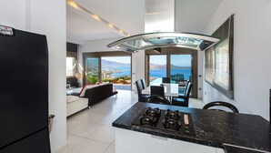 Villa, 3 Bedrooms, Sea View | Private kitchen | Espresso maker, full-sized fridge, microwave, oven - Elounda Black Pearl Villa (Agios Nikolaos)