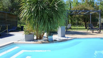 Seasonal outdoor pool, open 10:00 AM to 8:00 PM, pool loungers