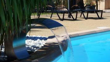 Seasonal outdoor pool, open 10:00 AM to 8:00 PM, sun loungers