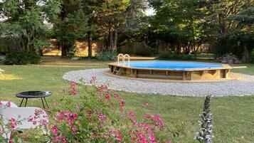 Seasonal outdoor pool, pool loungers