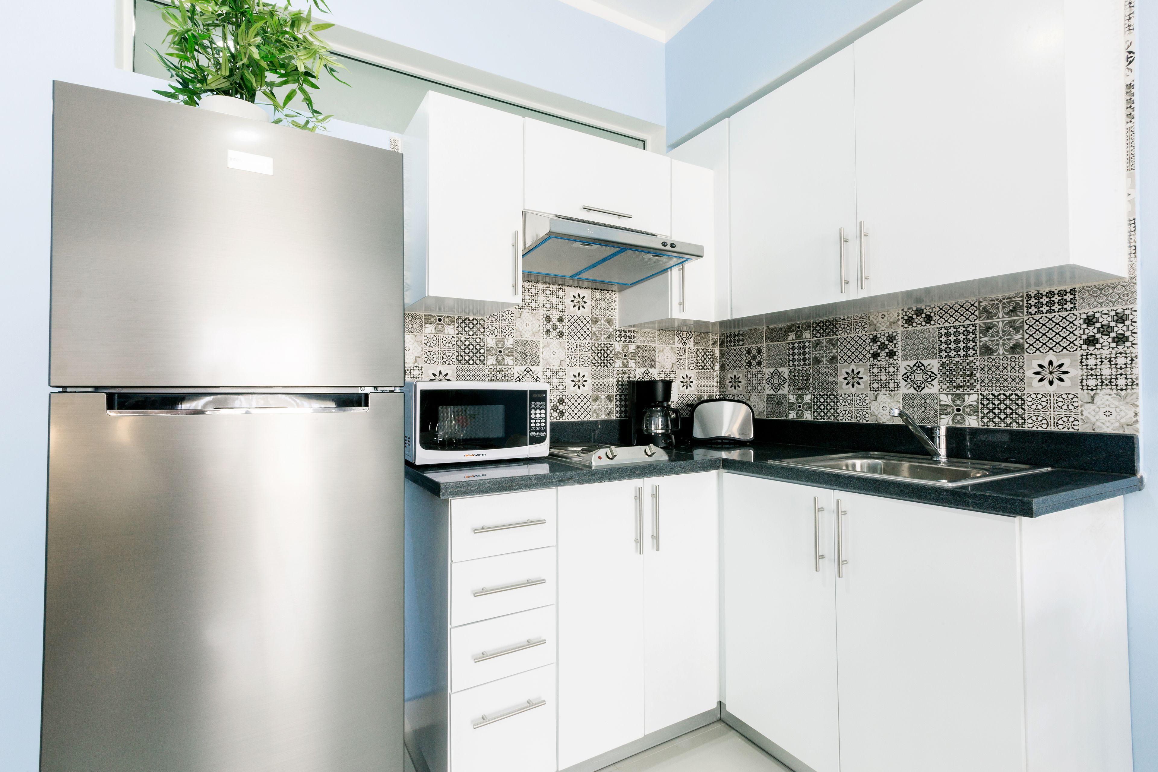 full-sized fridge, microwave, coffee/tea maker, cookware/dishes/utensils