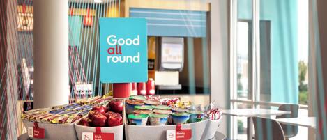 A display of packaged food items with labels such as 'Energy boost' and 'Fruit burst' in a modern, well-lit indoor setting.