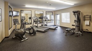 A gym with treadmills, elliptical machines, and a weight bench. - Candlewood Suites Memphis East by IHG (Memphis)