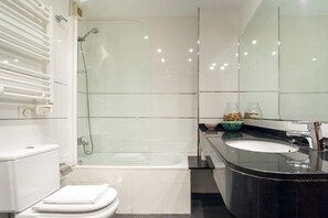 Bathtub, hair dryer, towels