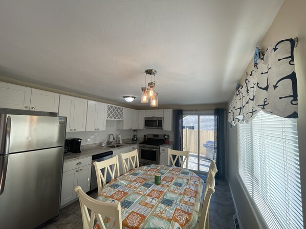Enjoy cooking in this well-equipped kitchen with a central island and stainless steel appliances.