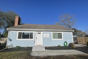 Stroll through the charming garden to the front door of this cozy home.