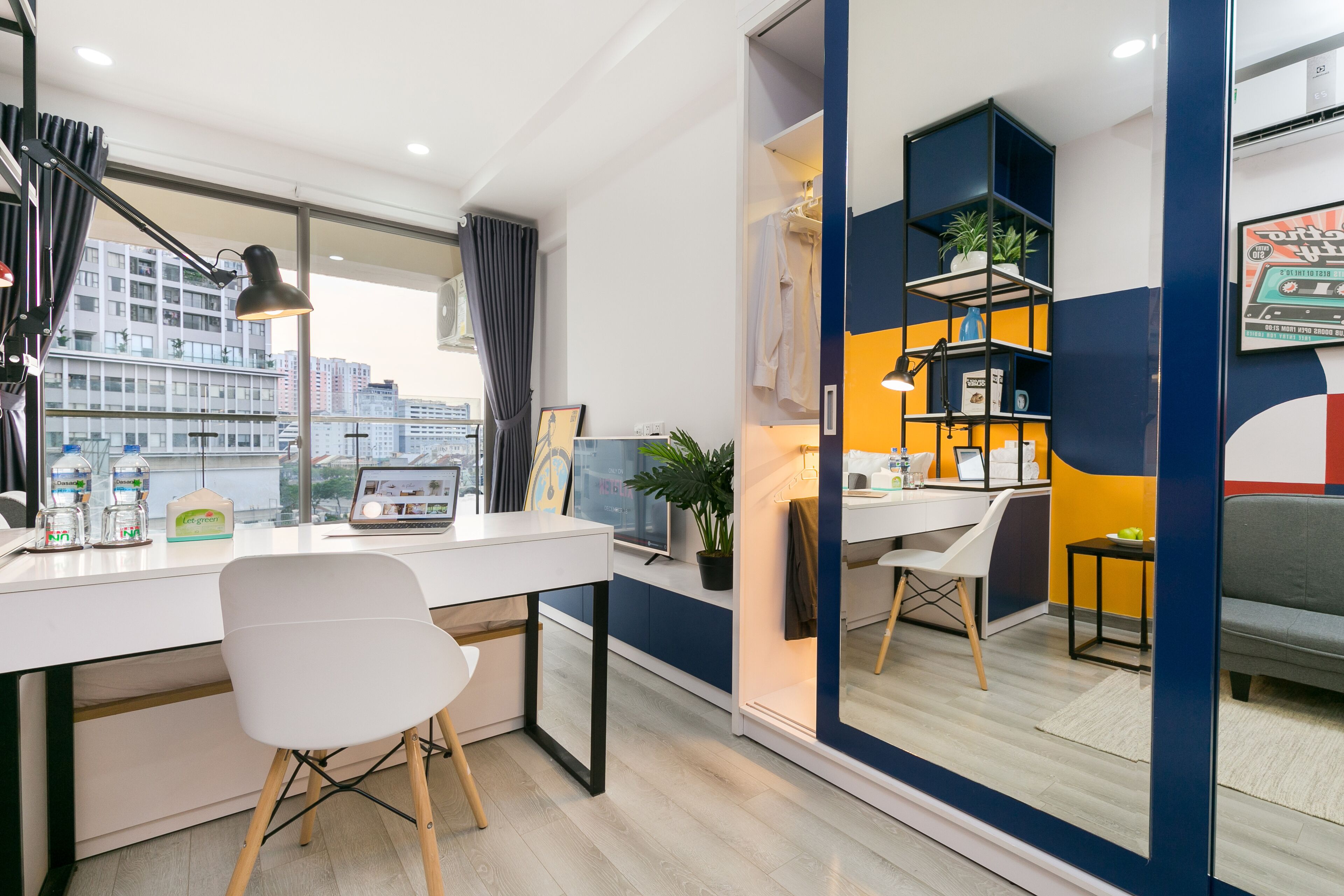 A modern office space with a desk, chair, and shelves.