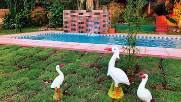 Outdoor pool, open 11:00 AM to 9:00 PM, pool umbrellas, sun loungers