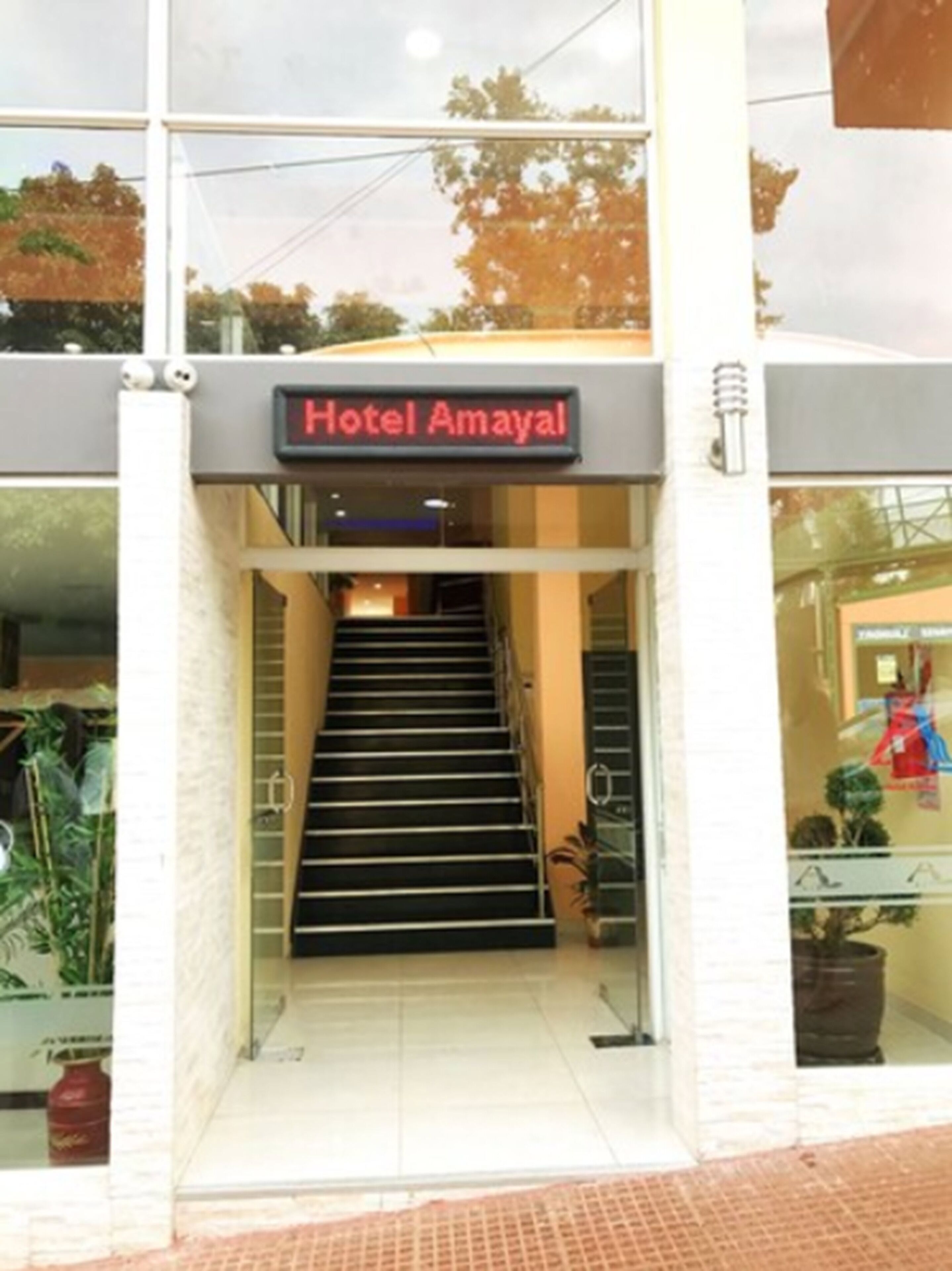 The entrance to Hotel Amayal with a staircase leading to the lobby.