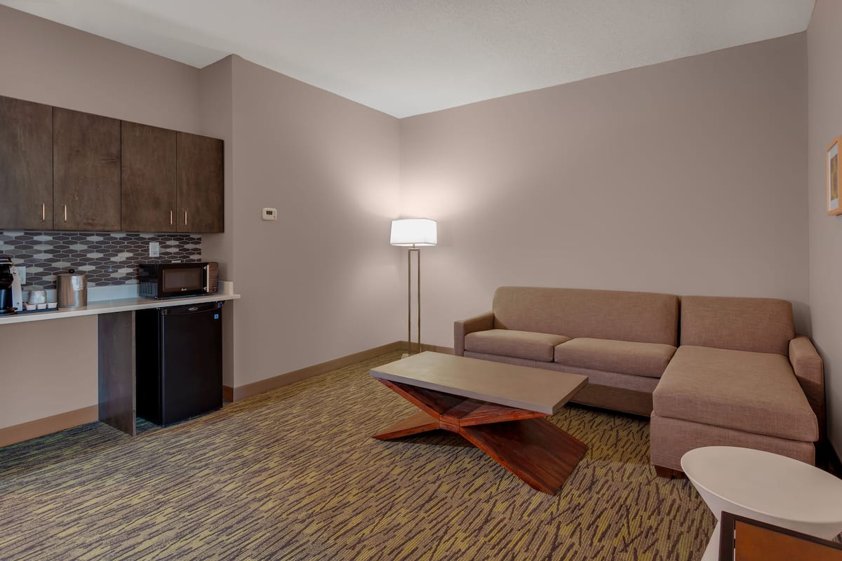 hypo-allergenic bedding, desk, laptop workspace, blackout curtains