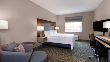 Hypo-allergenic bedding, desk, laptop workspace, blackout drapes