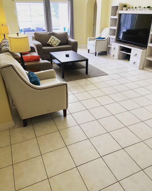 Flat-screen TV, DVD player, table football, toys