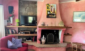 TV, fireplace, books, stereo