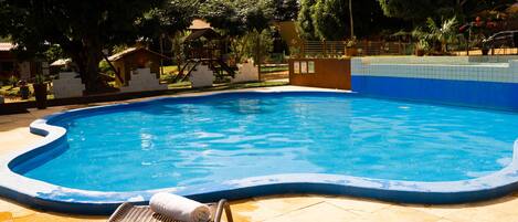 Outdoor pool, open 9:30 AM to 6:00 PM, pool loungers