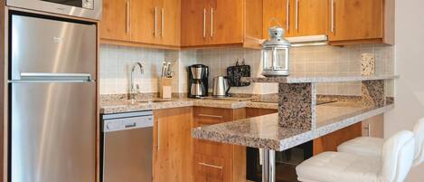 Fridge, stovetop, dishwasher, coffee/tea maker