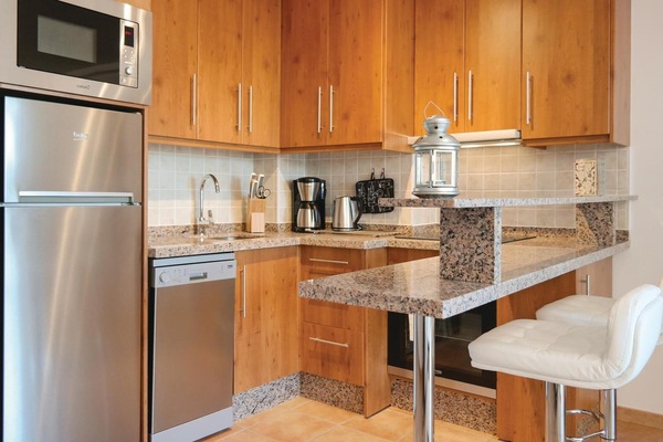 Fridge, stovetop, dishwasher, coffee/tea maker