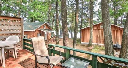 Lakeside resort cabin right on Little Saint with dock, sandy beach, firepit!