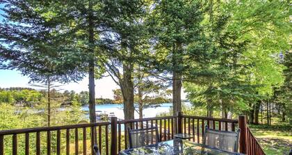 Lakefront log cabin on Lost Lake with dock, kayaks, large deck, and fire pit!