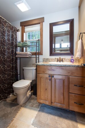 Combined shower/bathtub, hair dryer, towels - Going to the Sun Chalet A/Canadian Chalet (West Glacier)