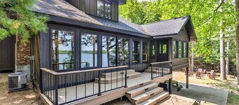 Newly remodeled private lakefront home with dock, enclosed porch, and fire pit!